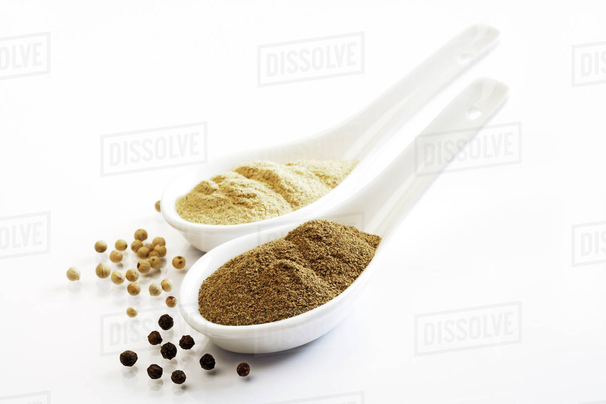 Ground black and white pepper Stock Photo Dissolve