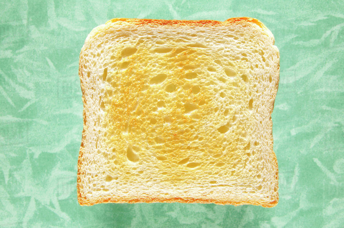 Slice of toast, closeup, elevated view Stock Photo Dissolve