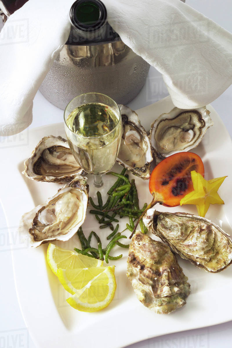 Fresh oysters, elevated view Stock Photo Dissolve