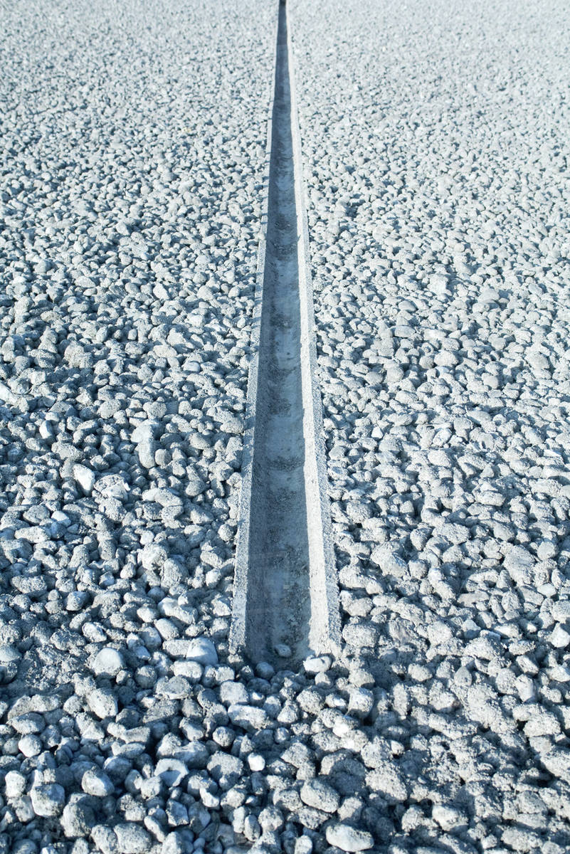 Gravel and concrete drain Stock Photo Dissolve