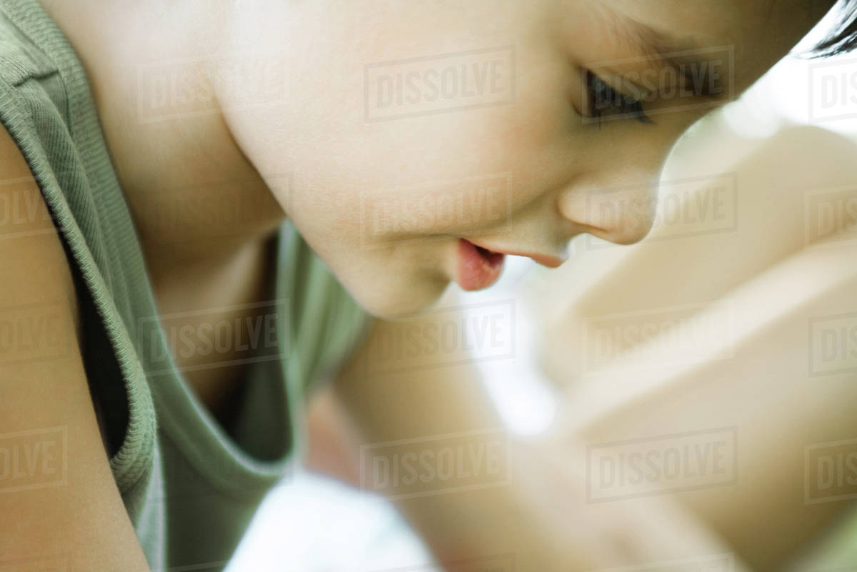 Little boy, side view of face, looking down, cropped Royalty-free stock photo