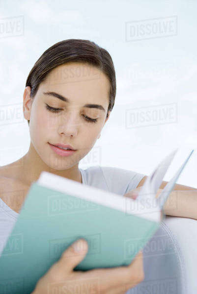 Female reading book, close-up - Royalty-free Stock Photo | Dissolve