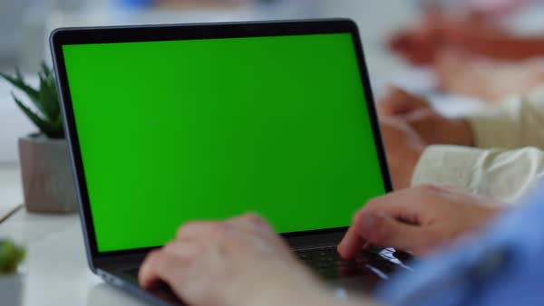 Man hands typing green screen laptop office. Unknown male person using ...