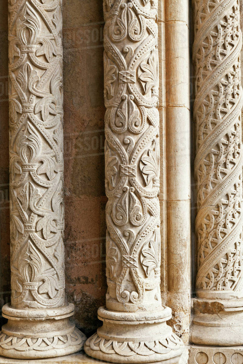 Detail of intricately carved stone pillars Stock Photo Dissolve