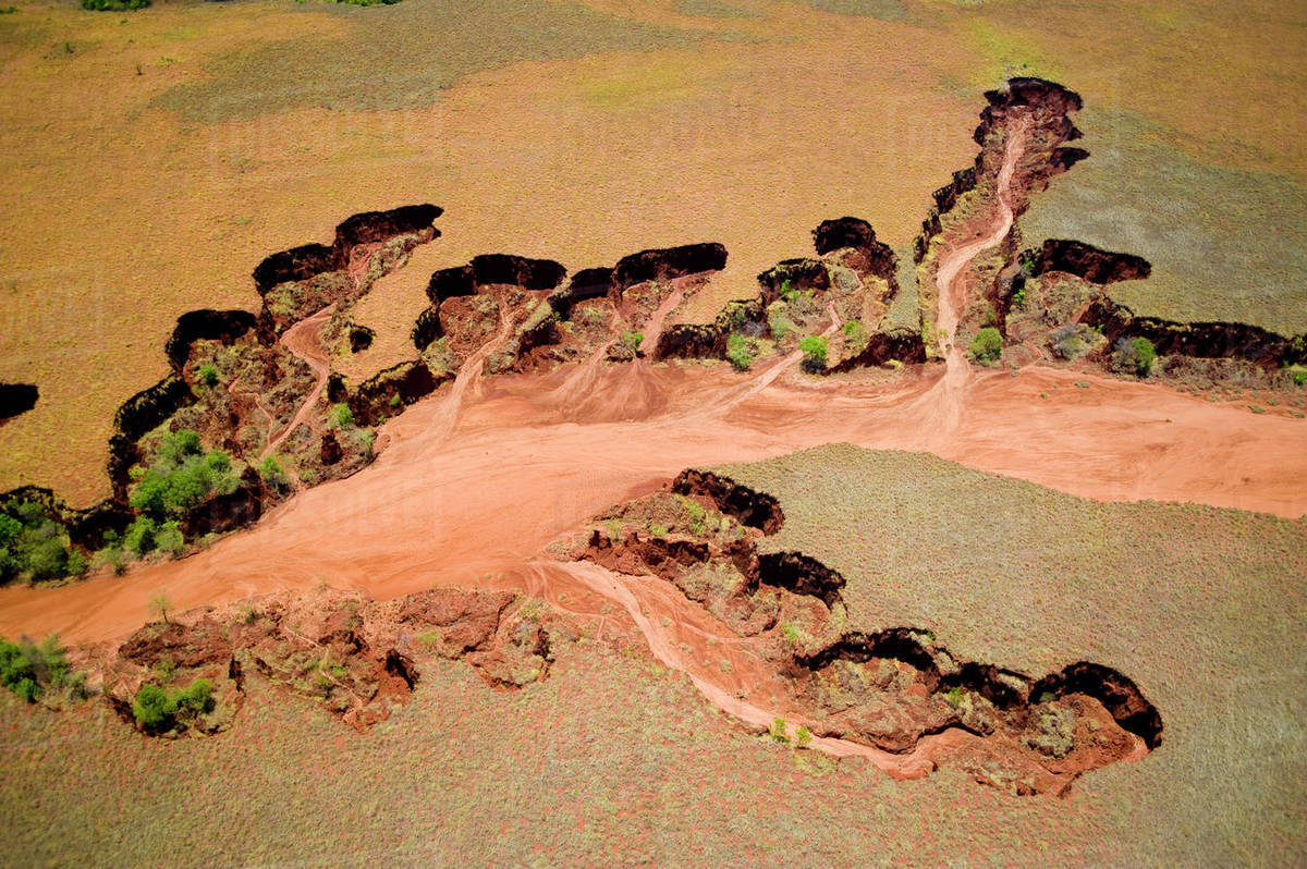 Aerial view of eroded banks and river with suspended load, caused by