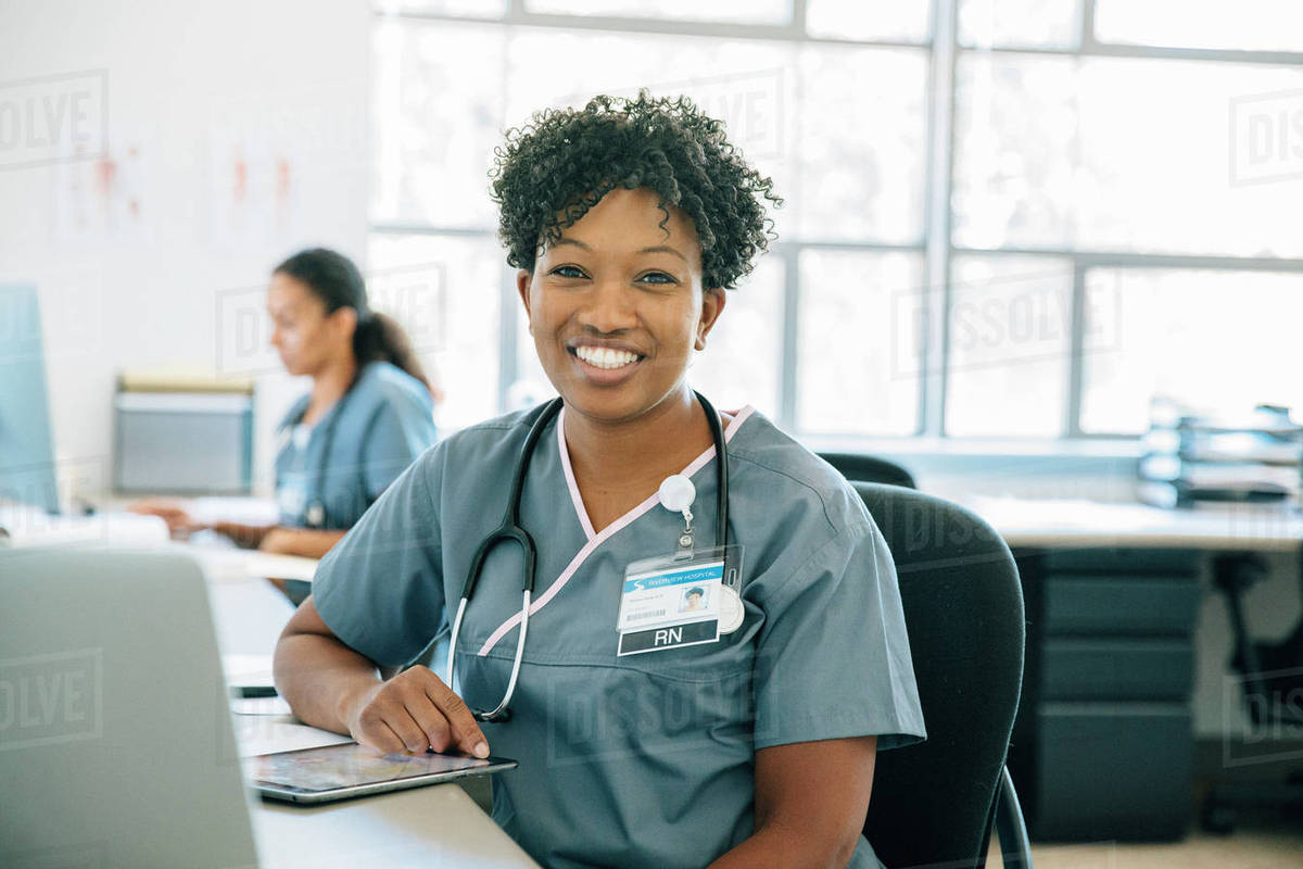 Portrait of smiling nurse with digital tablet Royalty-free stock photo