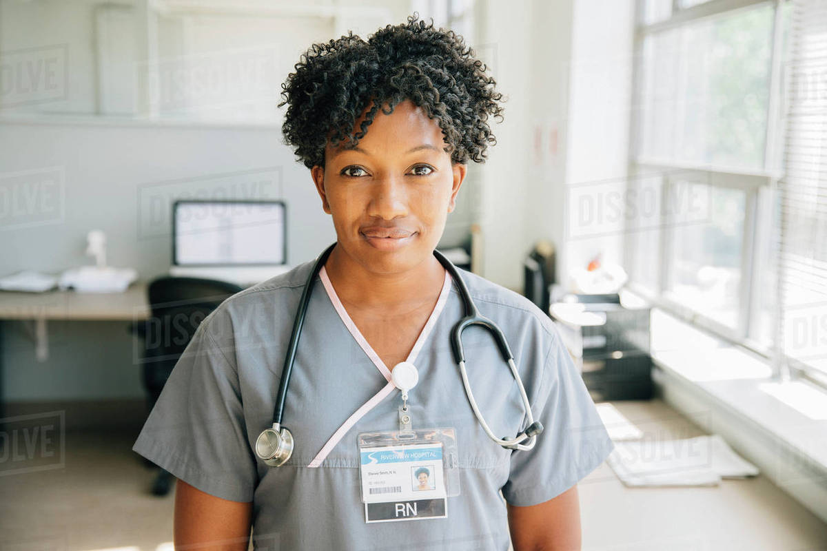 Portrait of nurse near window Royalty-free stock photo