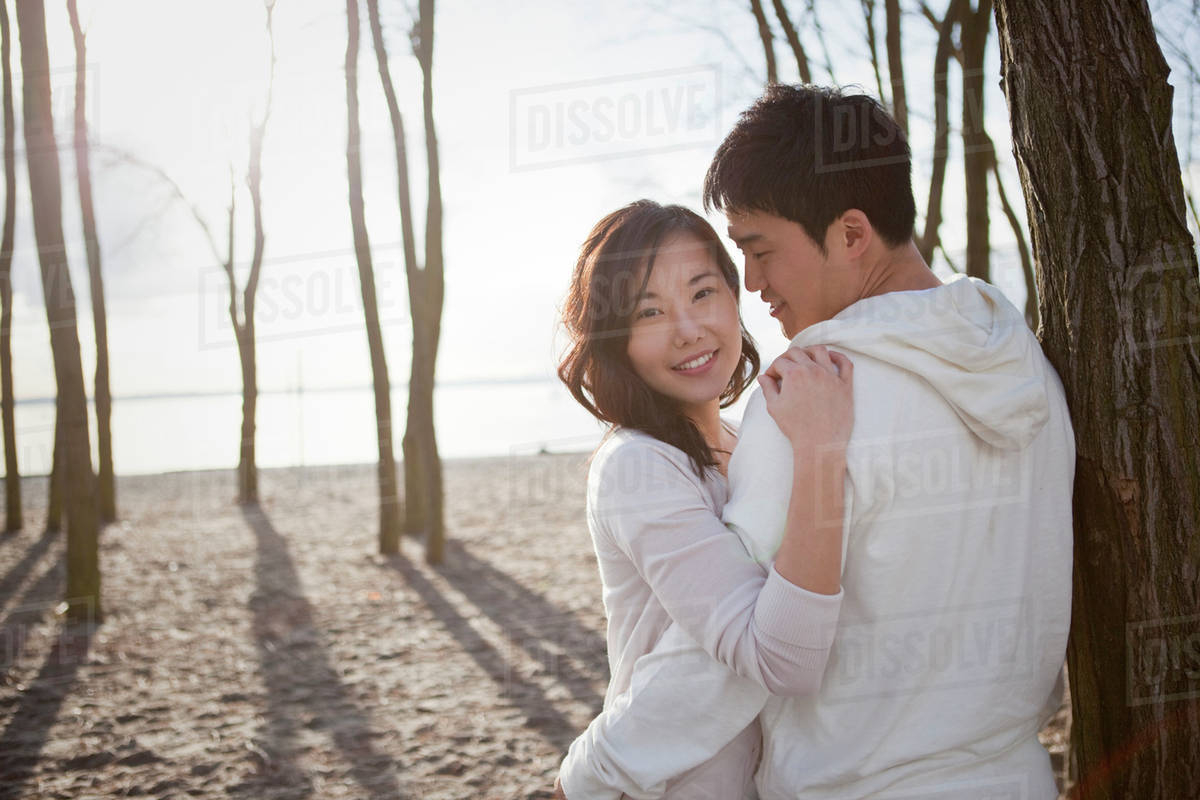 Korean couple hugging outdoors Stock Photo Dissolve