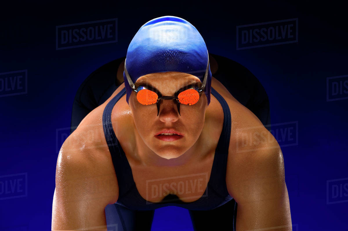 Serious swimmer in swim cap and goggles Stock Photo Dissolve