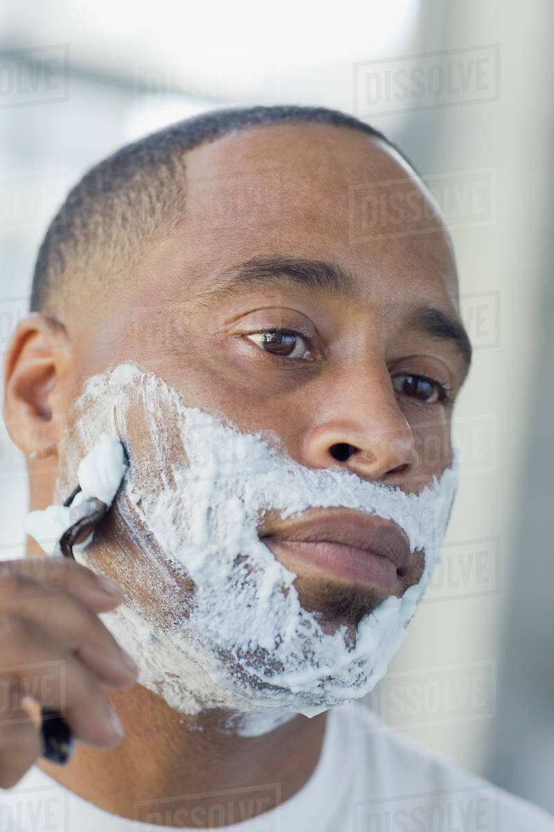 African man shaving Stock Photo Dissolve