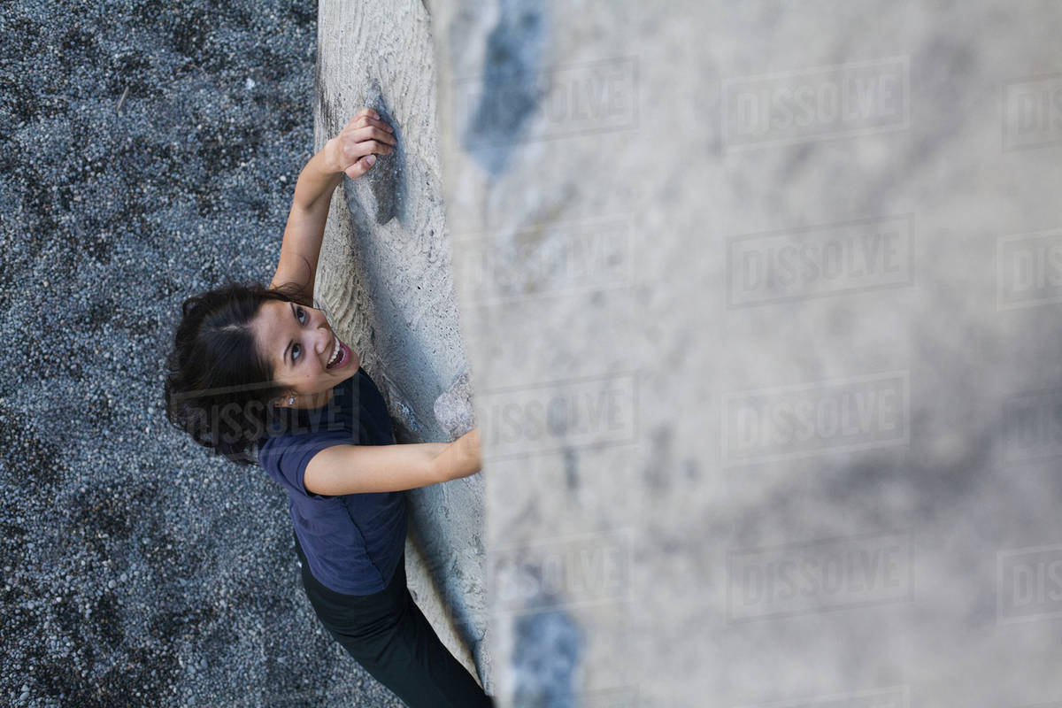 Filipino woman rock climbing Stock Photo Dissolve