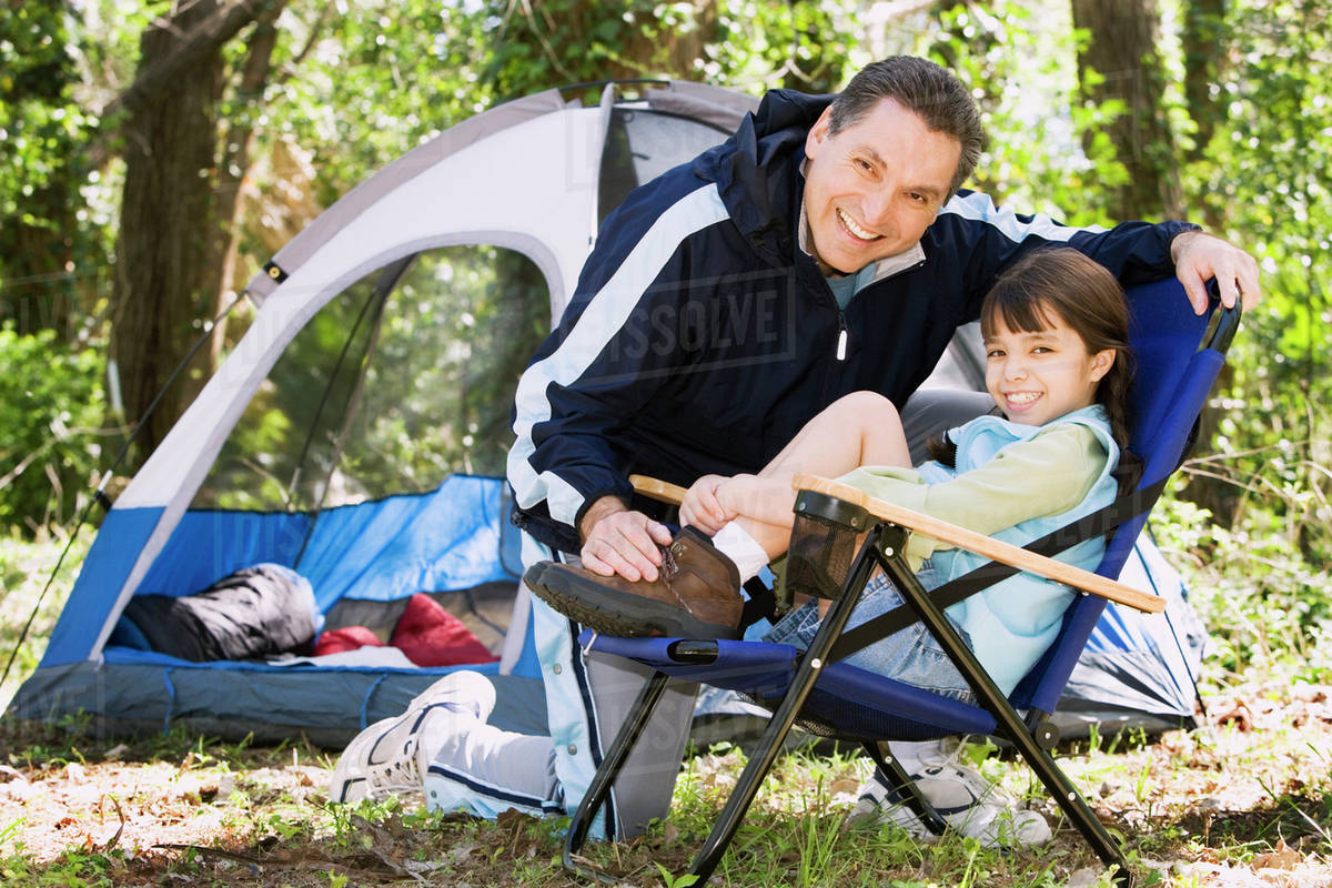 Father and daughter camping - Stock Photo - Dissolve