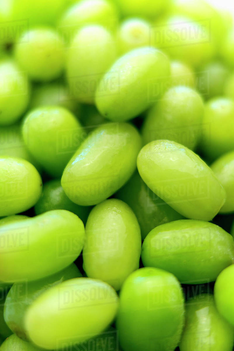 Pile of fresh wet green grapes Stock Photo Dissolve