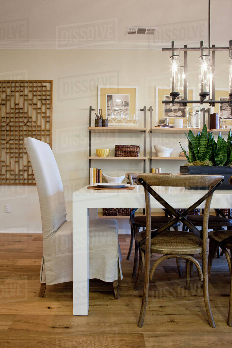 Chairs At Dining Table With Shelves In The Background Home Chairs At Dining Table With Shelves In The Background Home