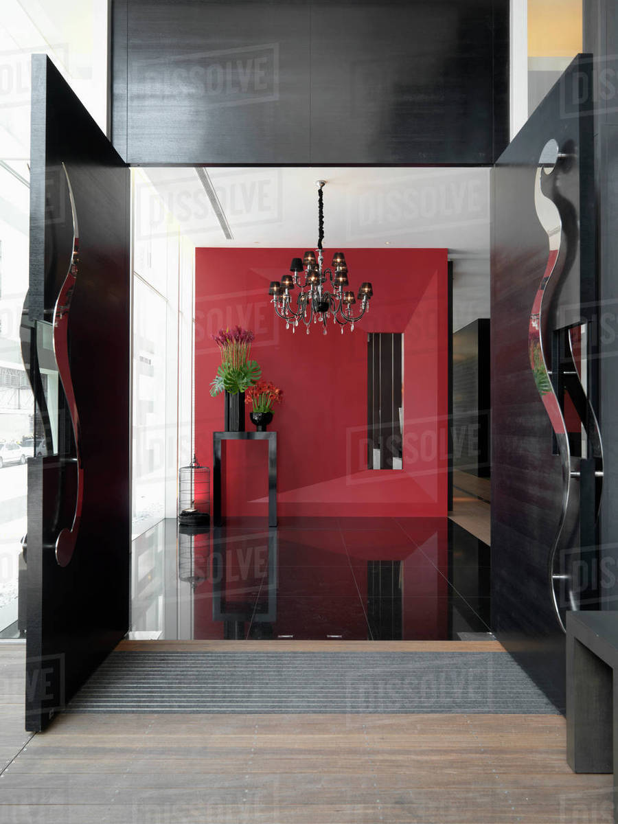 Modern Entrance Foyer With Red Wall Stock Photo Dissolve