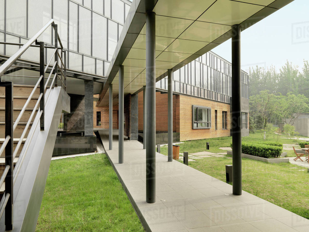 Covered walkway outside modern building Stock Photo Dissolve