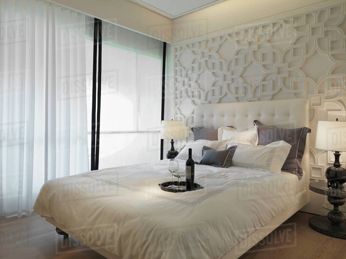 Collection of pillows on elegant white bed Stock Photo Dissolve