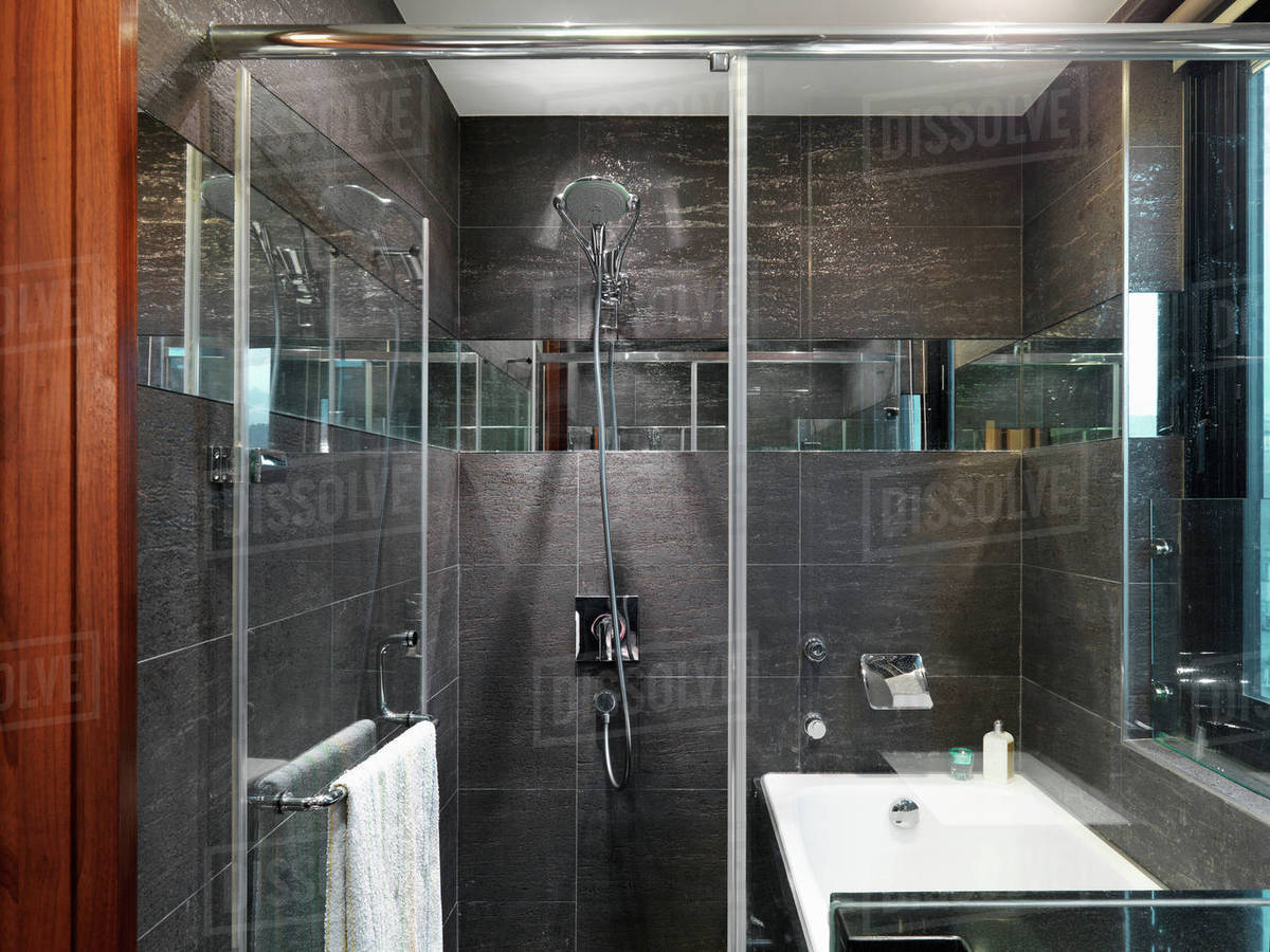 Black tile glass shower Stock Photo Dissolve