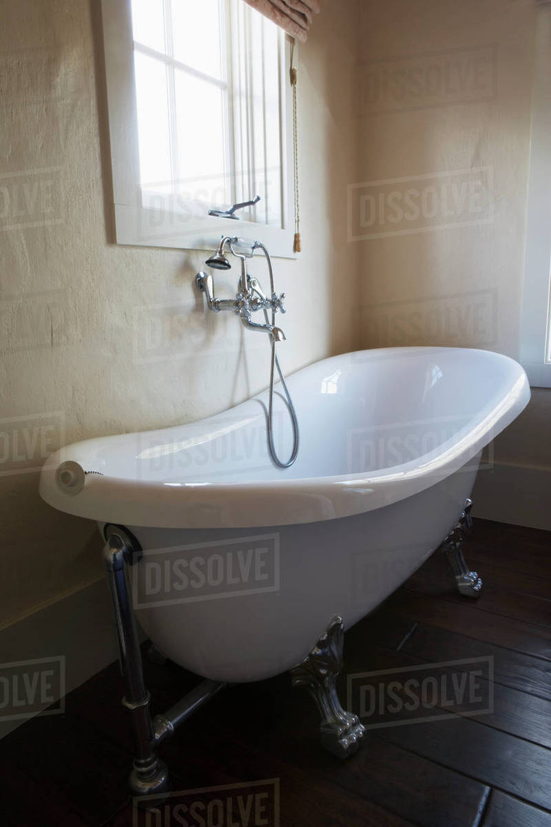 Spanish Style Claw Foot Tub and Chrome Faucet Stock Photo Dissolve