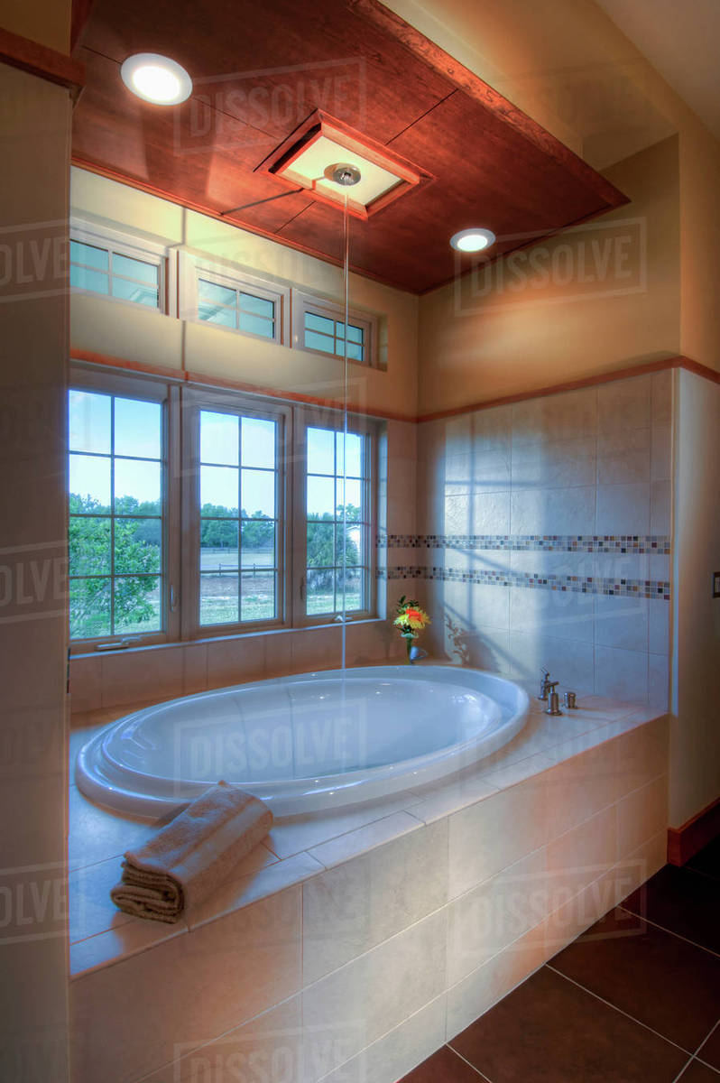 Master bathtub that fills from the ceiling Stock Photo Dissolve