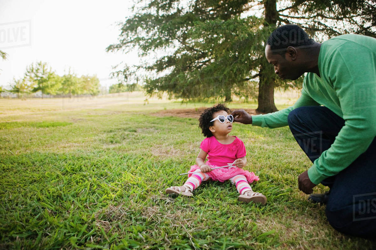 Black father and daughter enjoying the park Royalty-free stock photo