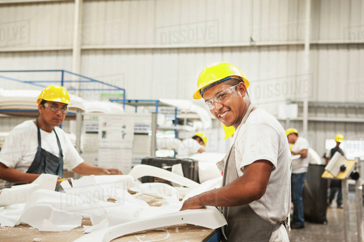 Men working in manufacturing plant Stock Photo Dissolve