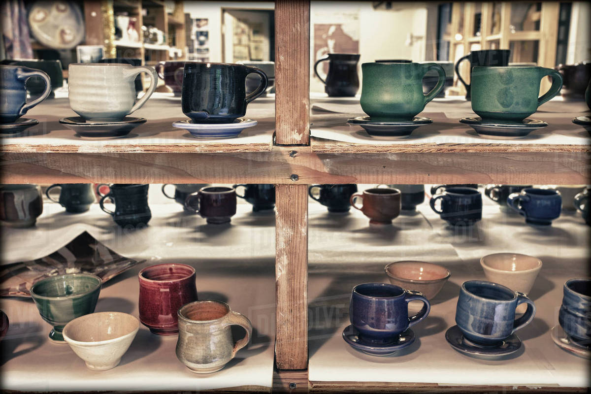 Pottery on shelves Stock Photo Dissolve