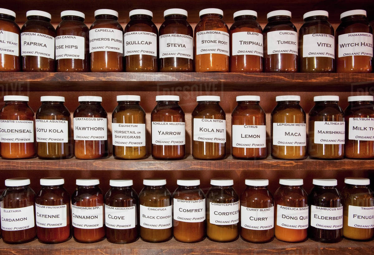 Shelves full of jars in an Apothecary shop Stock Photo Dissolve