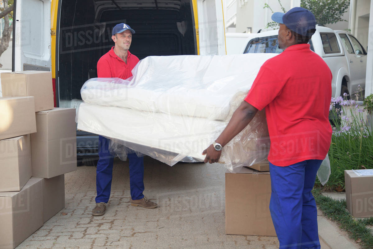 Movers carrying sofa to new home Stock Photo Dissolve