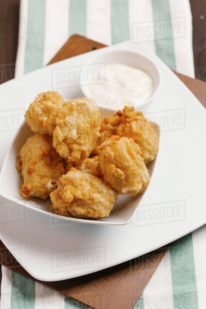Chicken nuggets and dipping sauce Stock Photo Dissolve