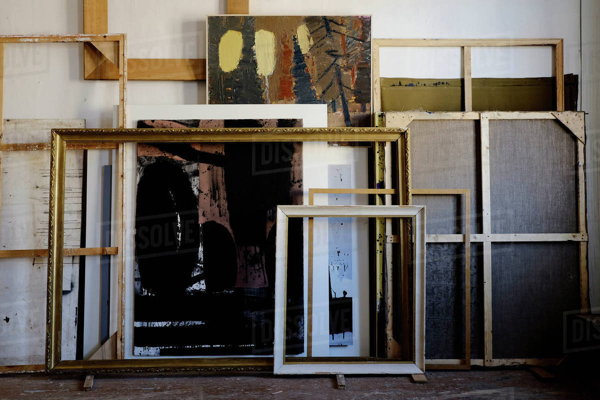 Paintings And Frames Leaning On Wall Stock Photo Dissolve Paintings And Frames Leaning On Wall