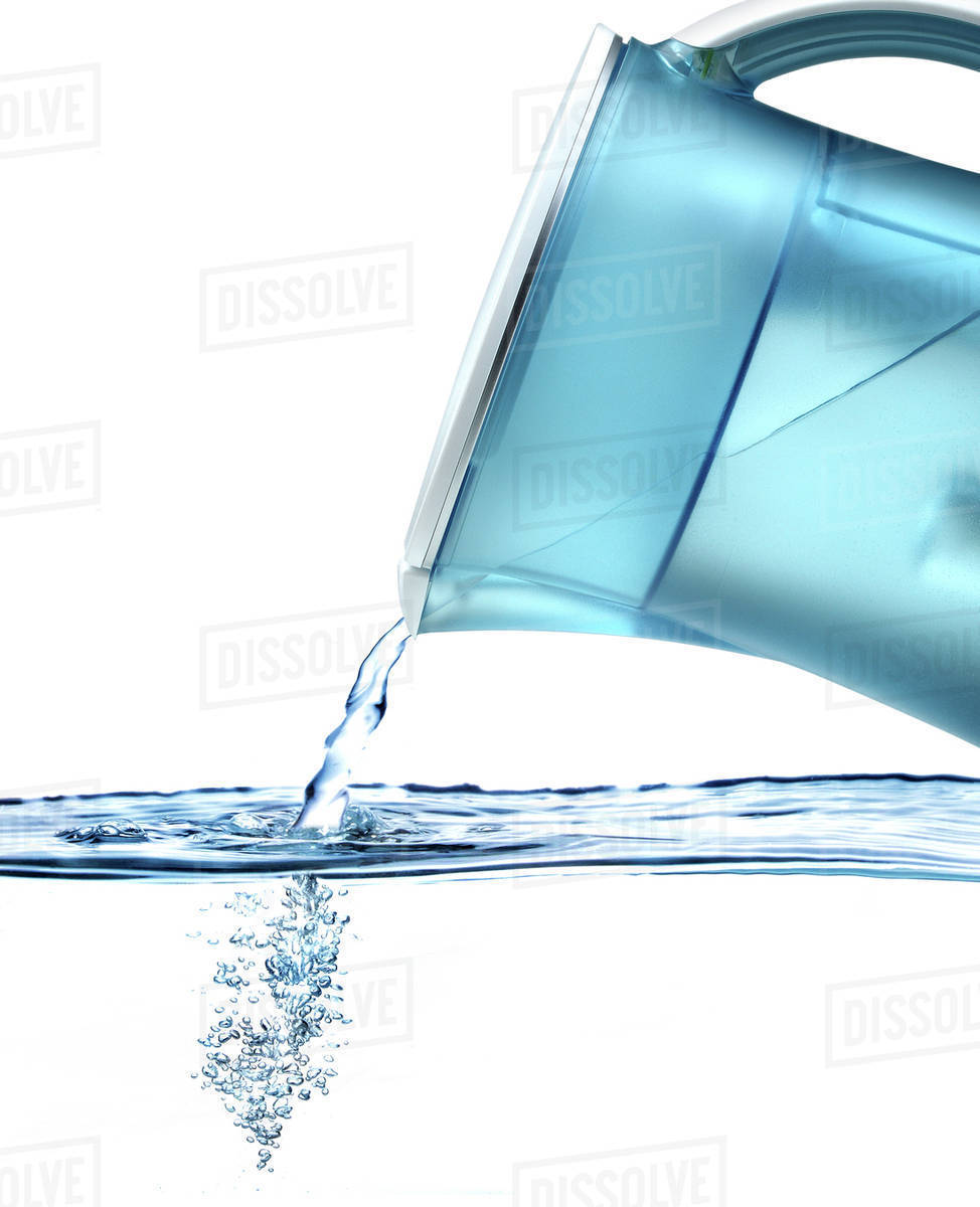 Pitcher pouring water Stock Photo Dissolve