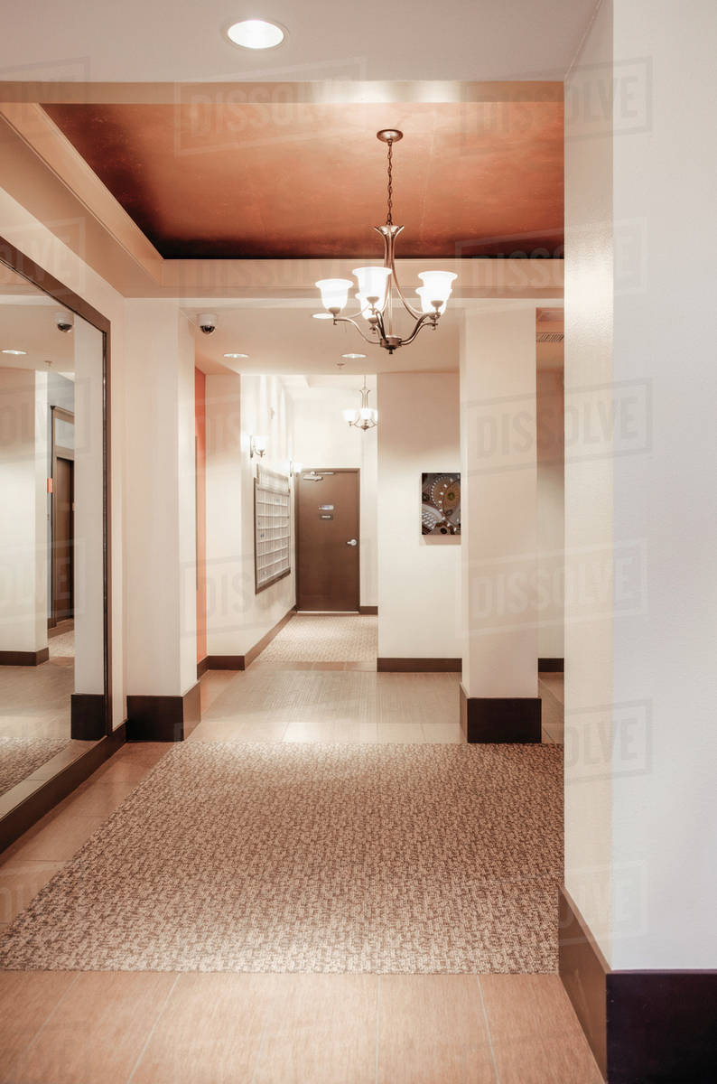 Chandelier And Mirror In Apartment Complex Entrance Stock Photo Chandelier And Mirror In Apartment Complex Entrance