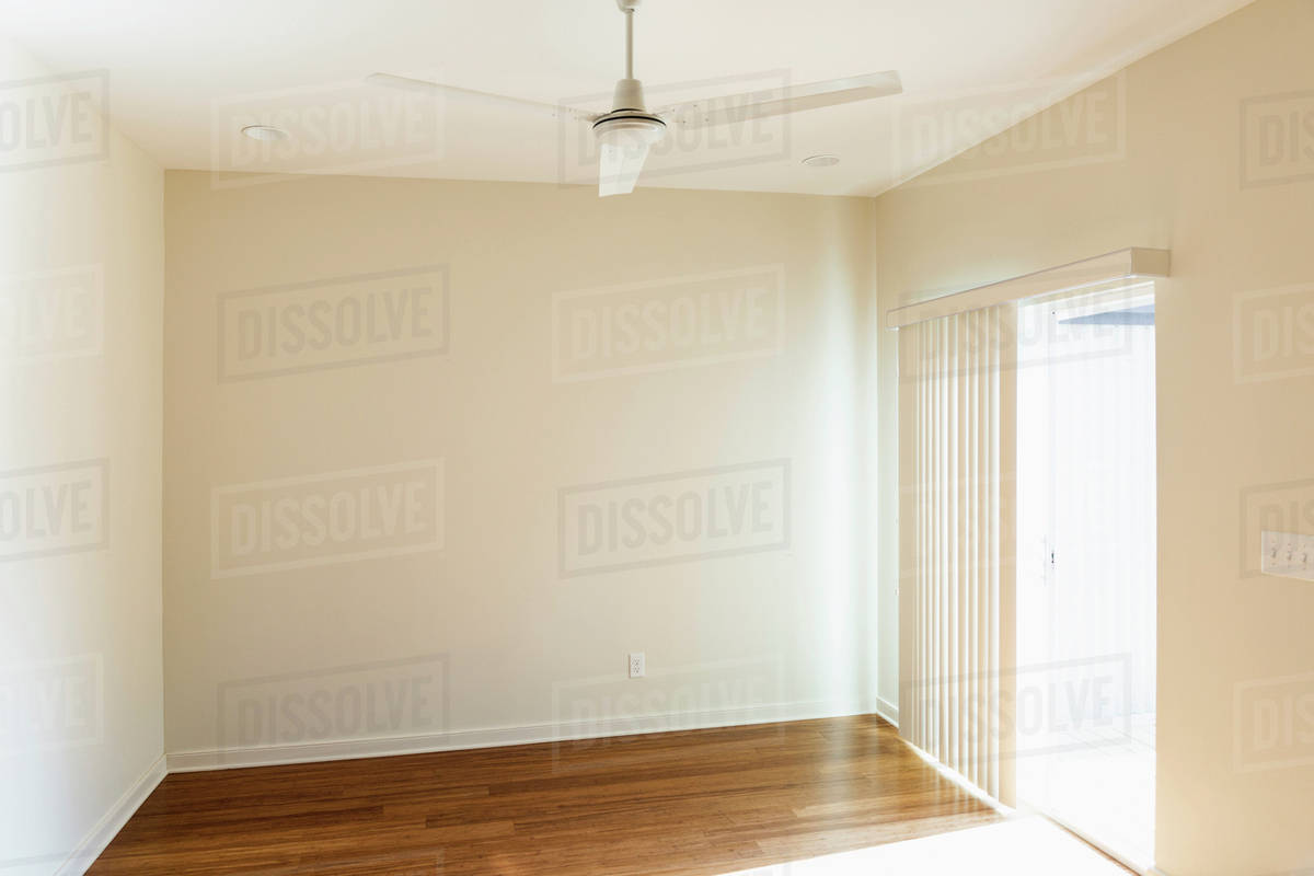 Ceiling fan over empty room Stock Photo Dissolve