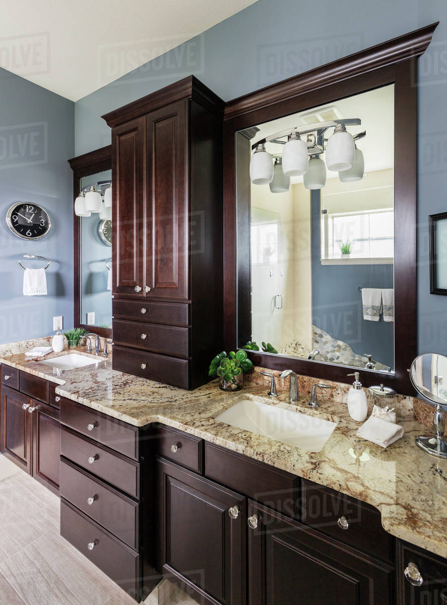 Double sinks, mirror and cabinets in modern bathroom - Royalty-free ...