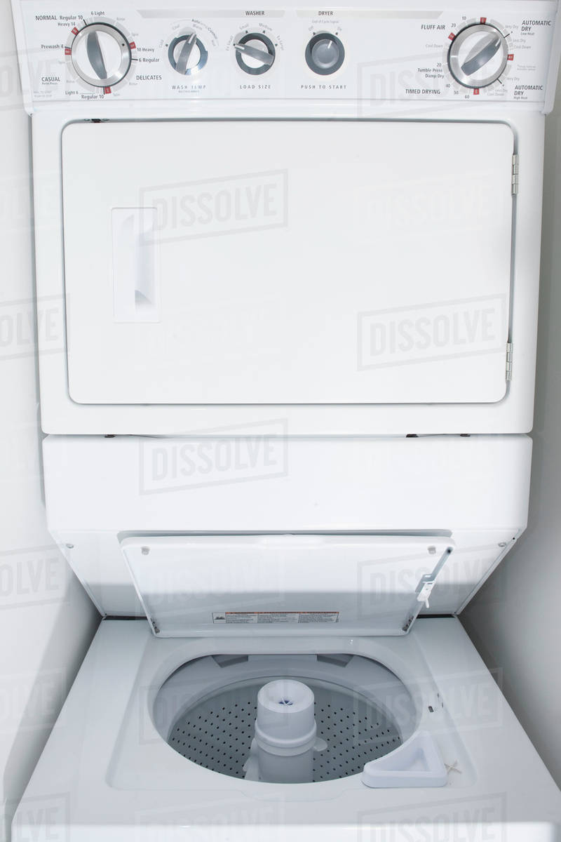 Close up of empty stacking washing machine and dryer Stock Photo