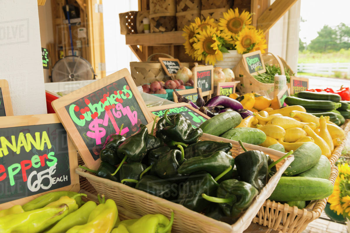 Baskets of produce at farmers market Stock Photo Dissolve