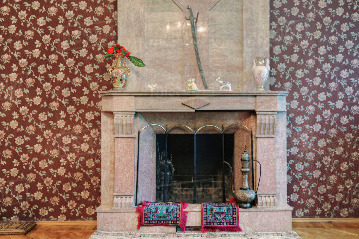 Stone fireplace and wallpaper - Stock Photo - Dissolve