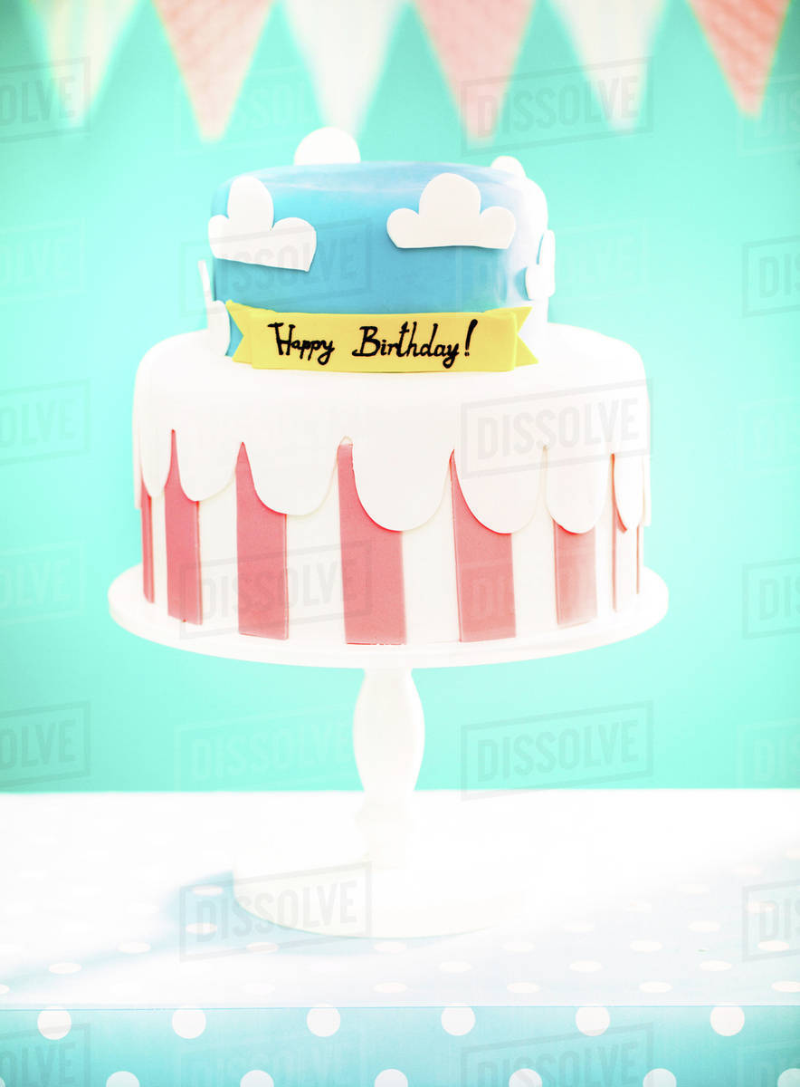 Birthday cake on platter at party Stock Photo Dissolve