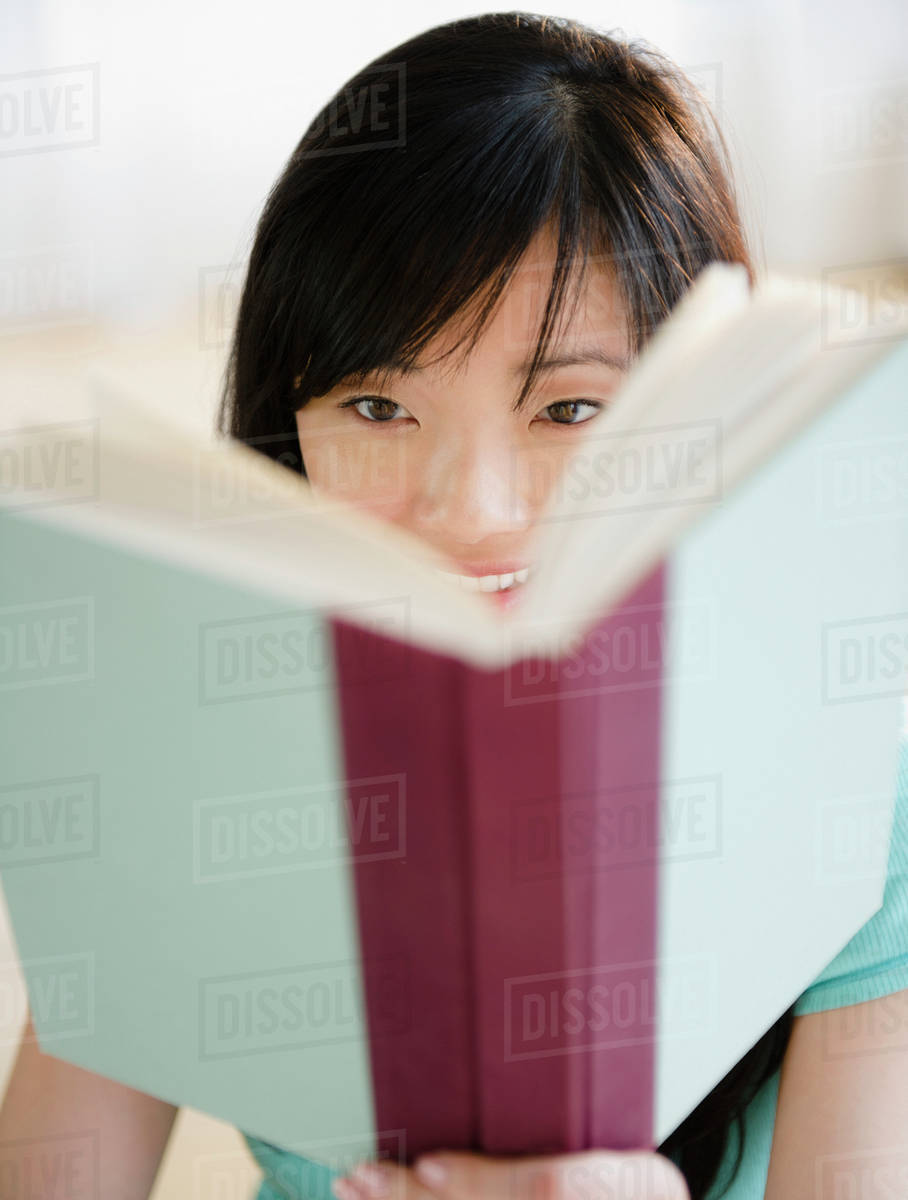 Korean woman reading book Stock Photo Dissolve