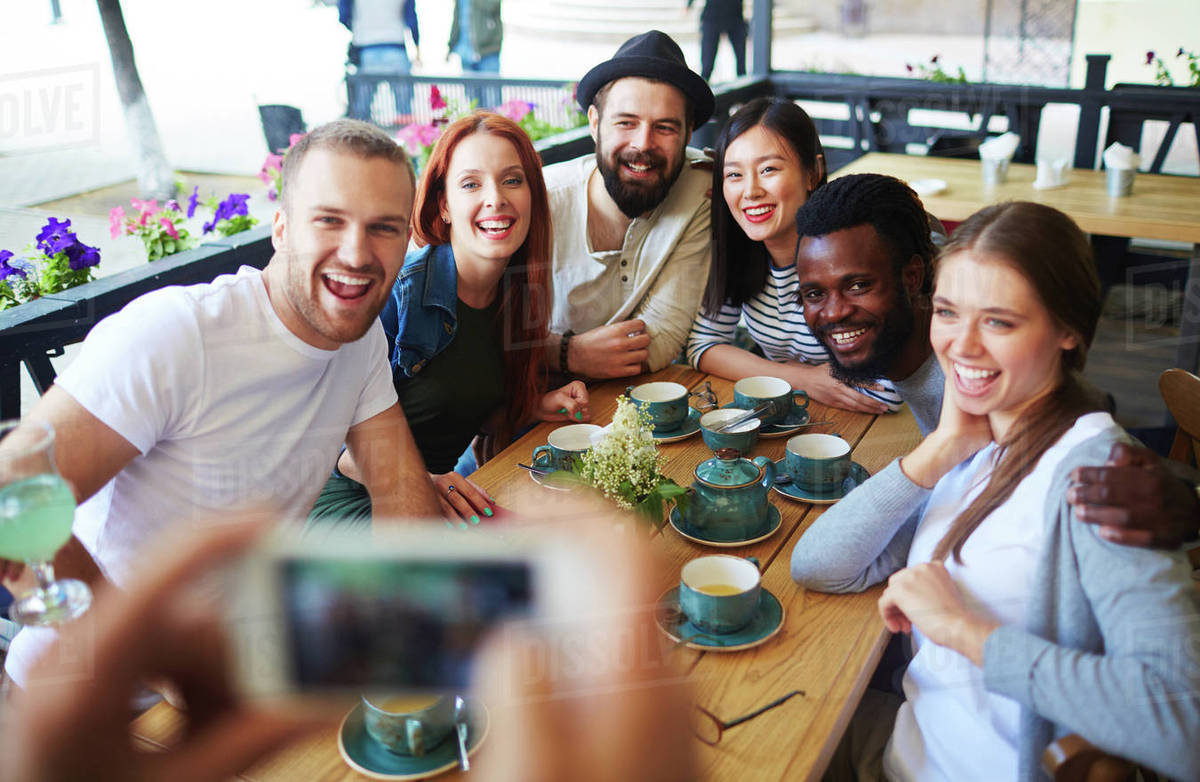 Friends making selfie during hangout Stock Photo Dissolve