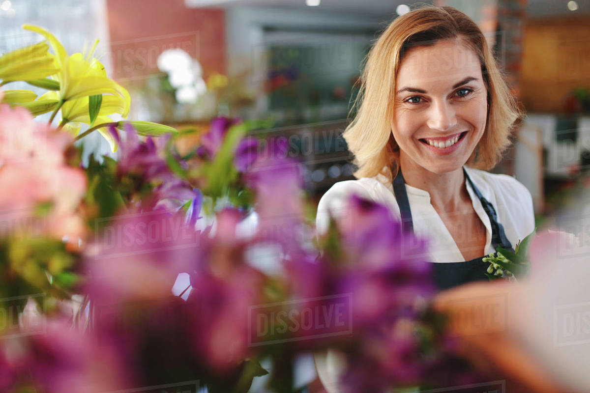 Young successful small business owner florist in her own flower shop