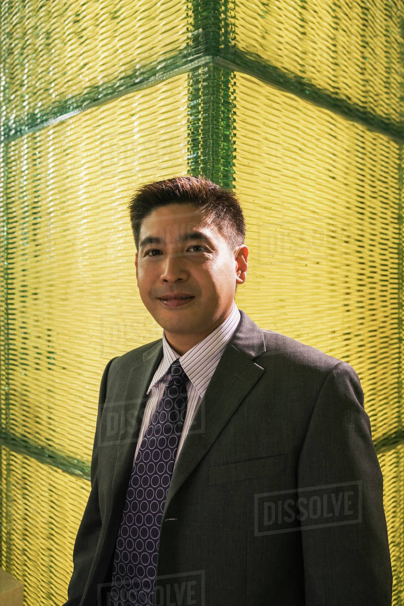 Smiling Chinese businessman Stock Photo Dissolve