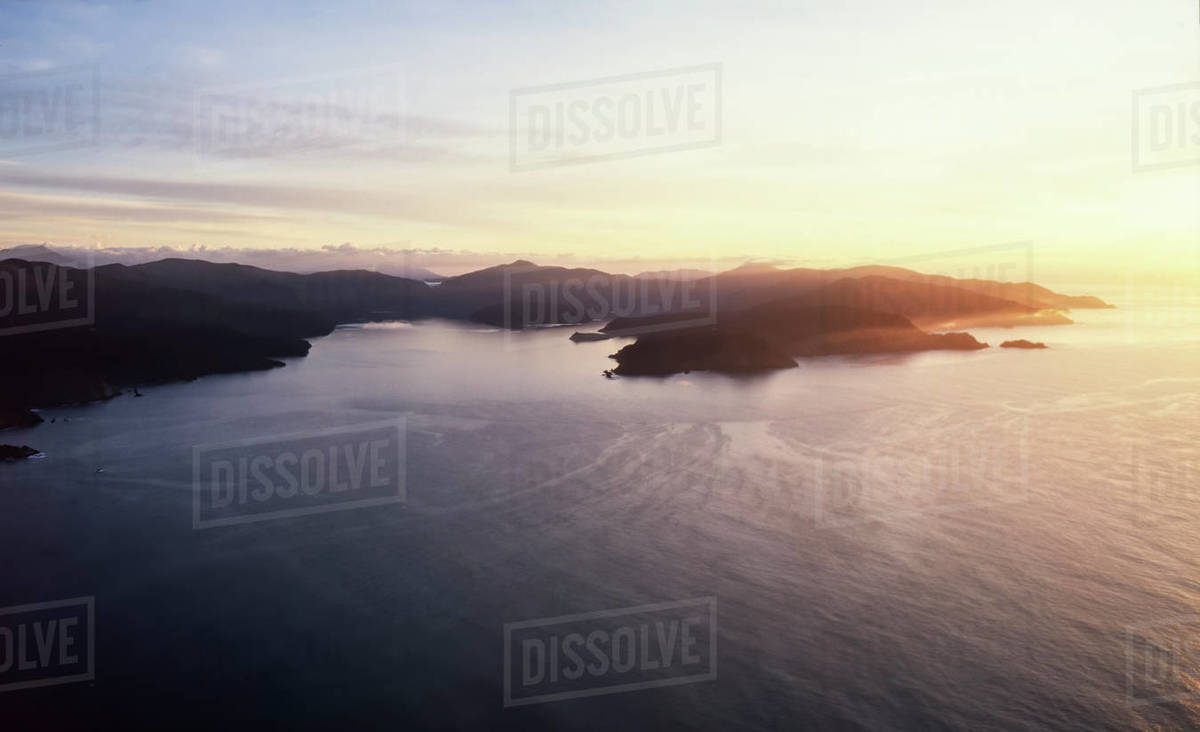 Aerial of Queen Charlotte Sounds at sunrise Stock Photo Dissolve