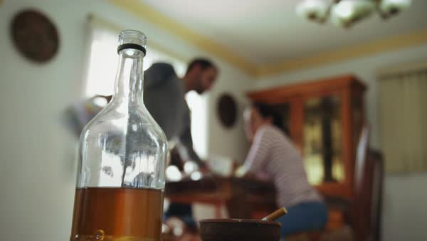 Young drunk man hitting and beating woman at home after drinking ...