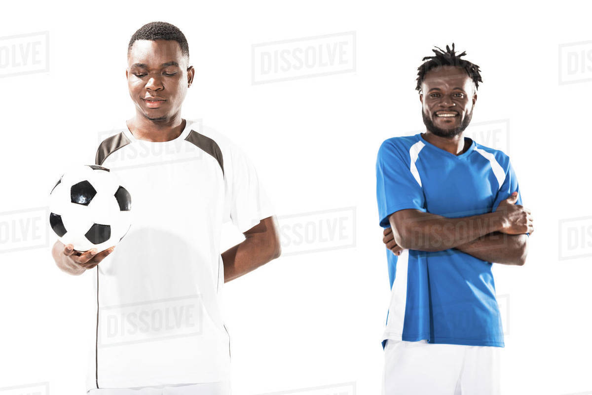 smiling athletic young african american soccer players standing