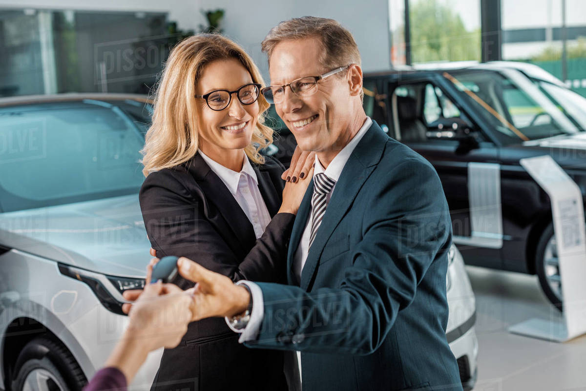 Key Car Dealership >> Partial View Of Female Car Dealer Giving Car Key To D2115 135 088 Key Car Dealership >> Partial View Of Female Car Dealer Giving Car Key To D2115 135 088