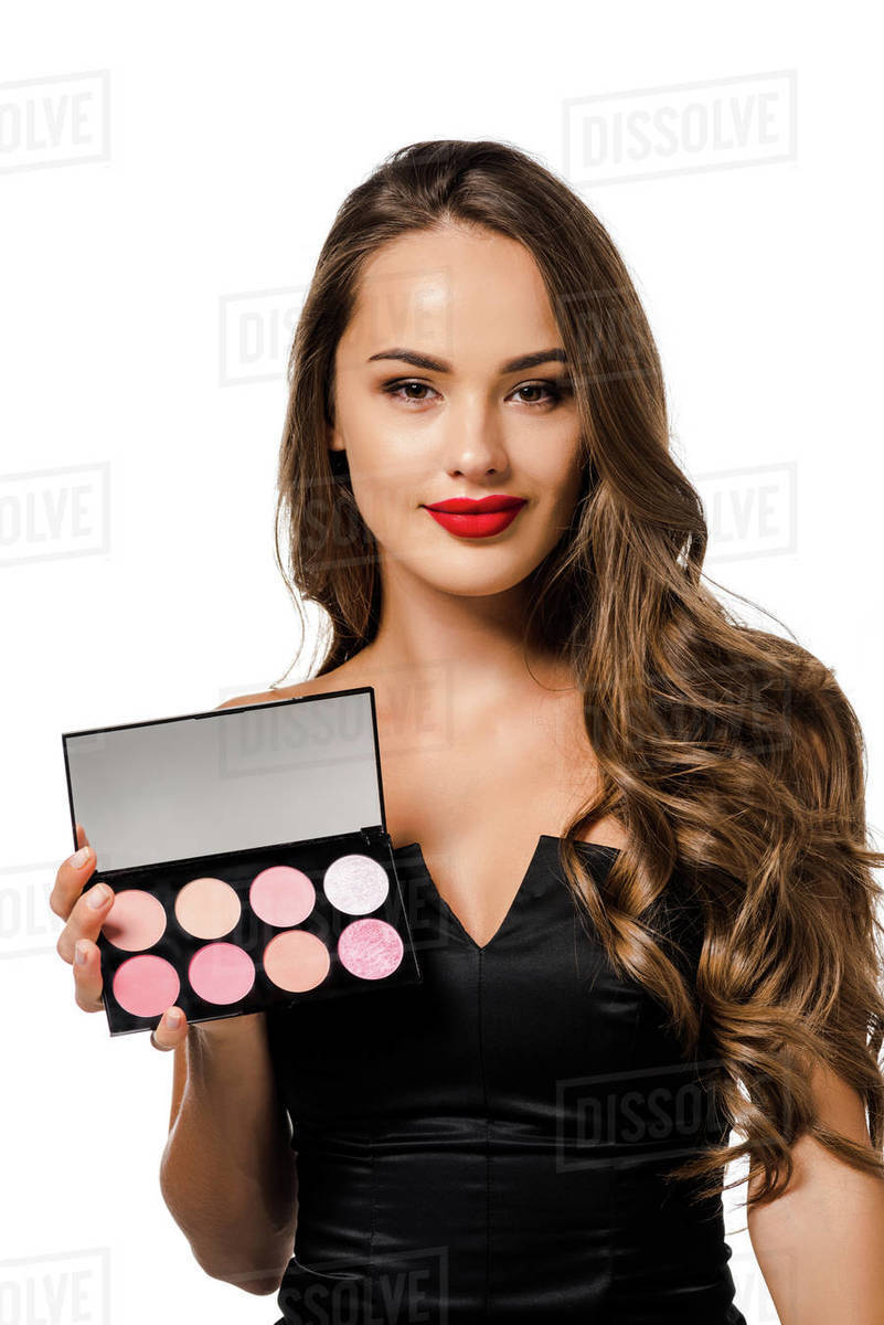 Beautiful girl in black dress with red lips holding palette with  eyeshadows, looking at camera and smiling isolated on white - Royalty-free  Stock Photo | Dissolve