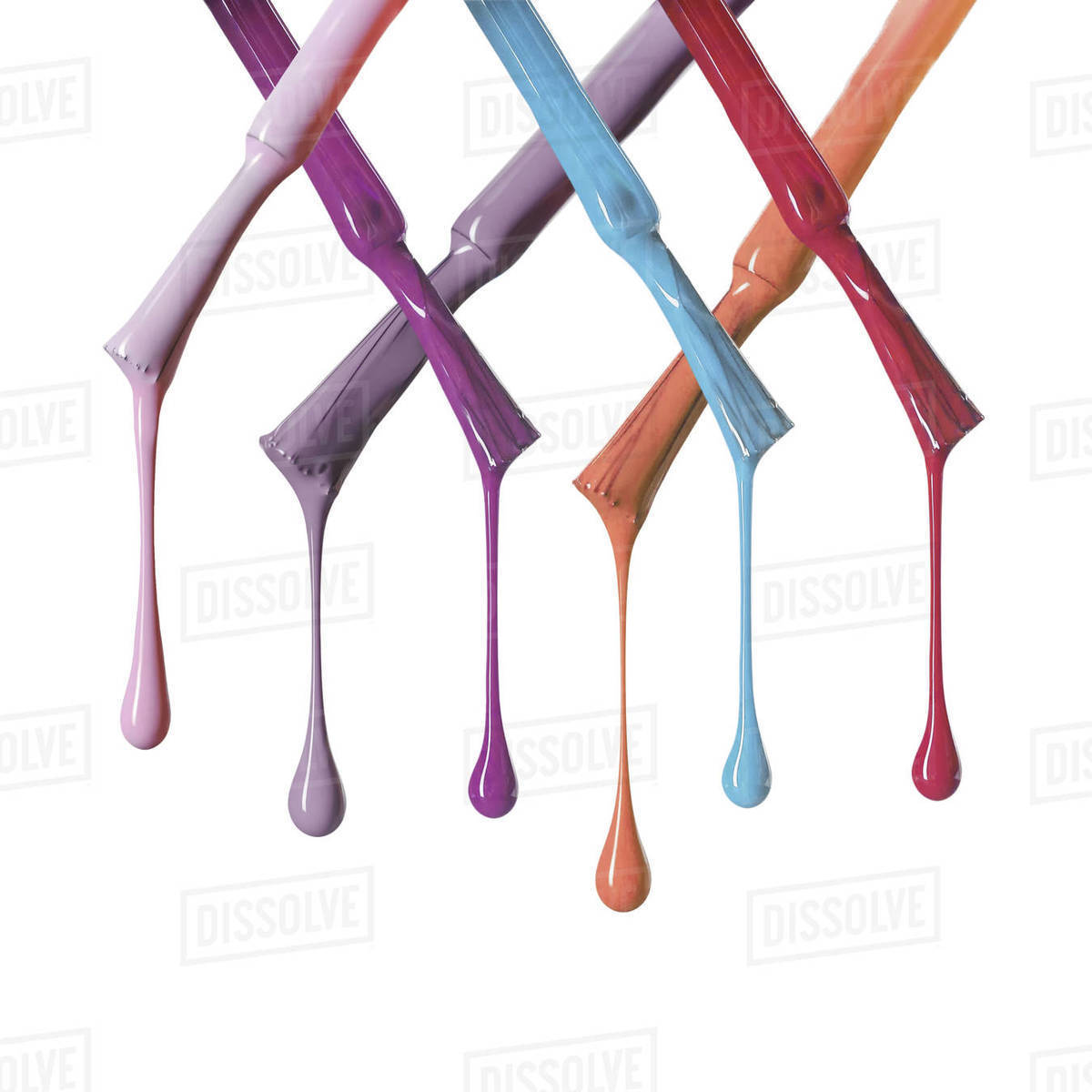 Brushes with wet dripping nail polish isolated on white Stock Photo