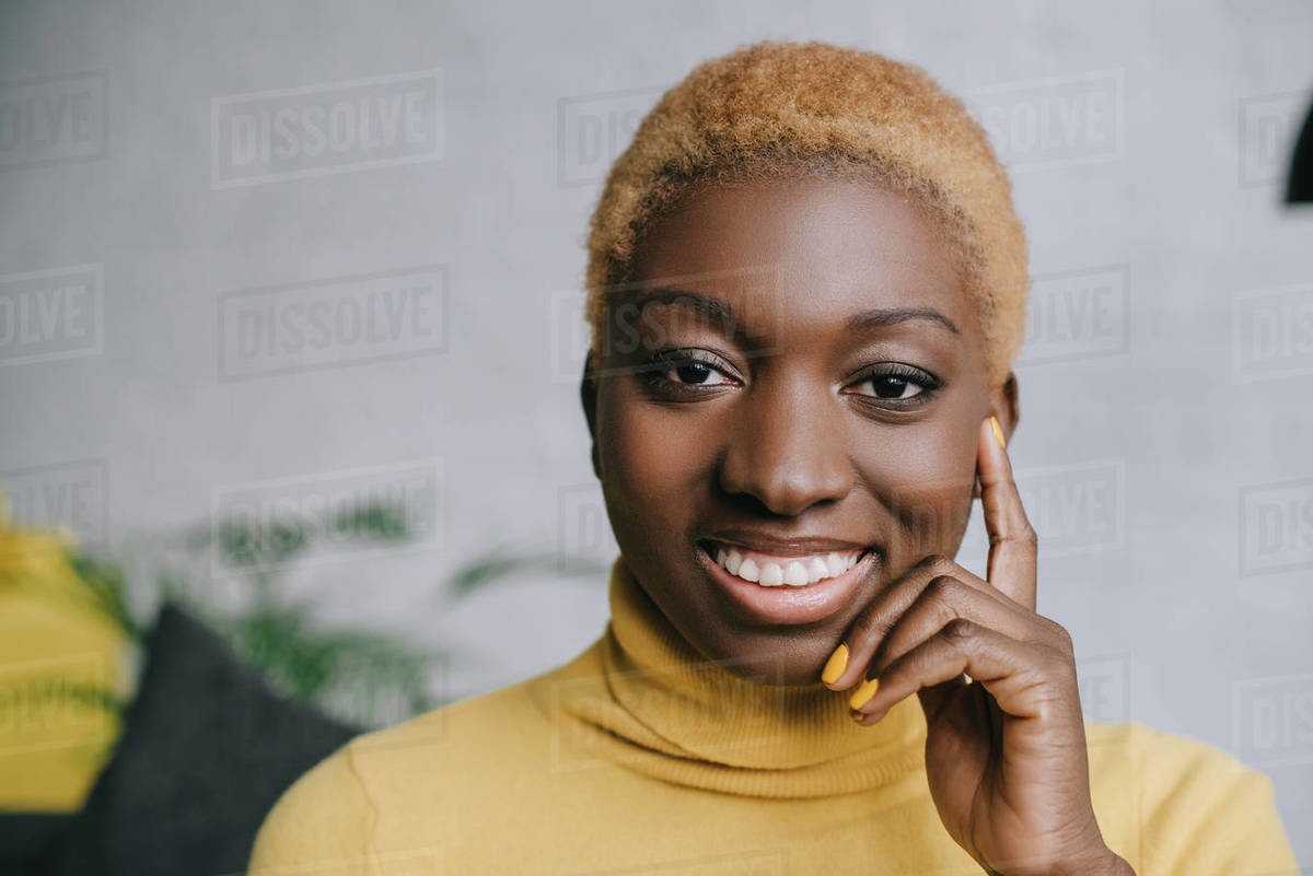 Close Up Of Happy African American Woman With Short Hair Stock